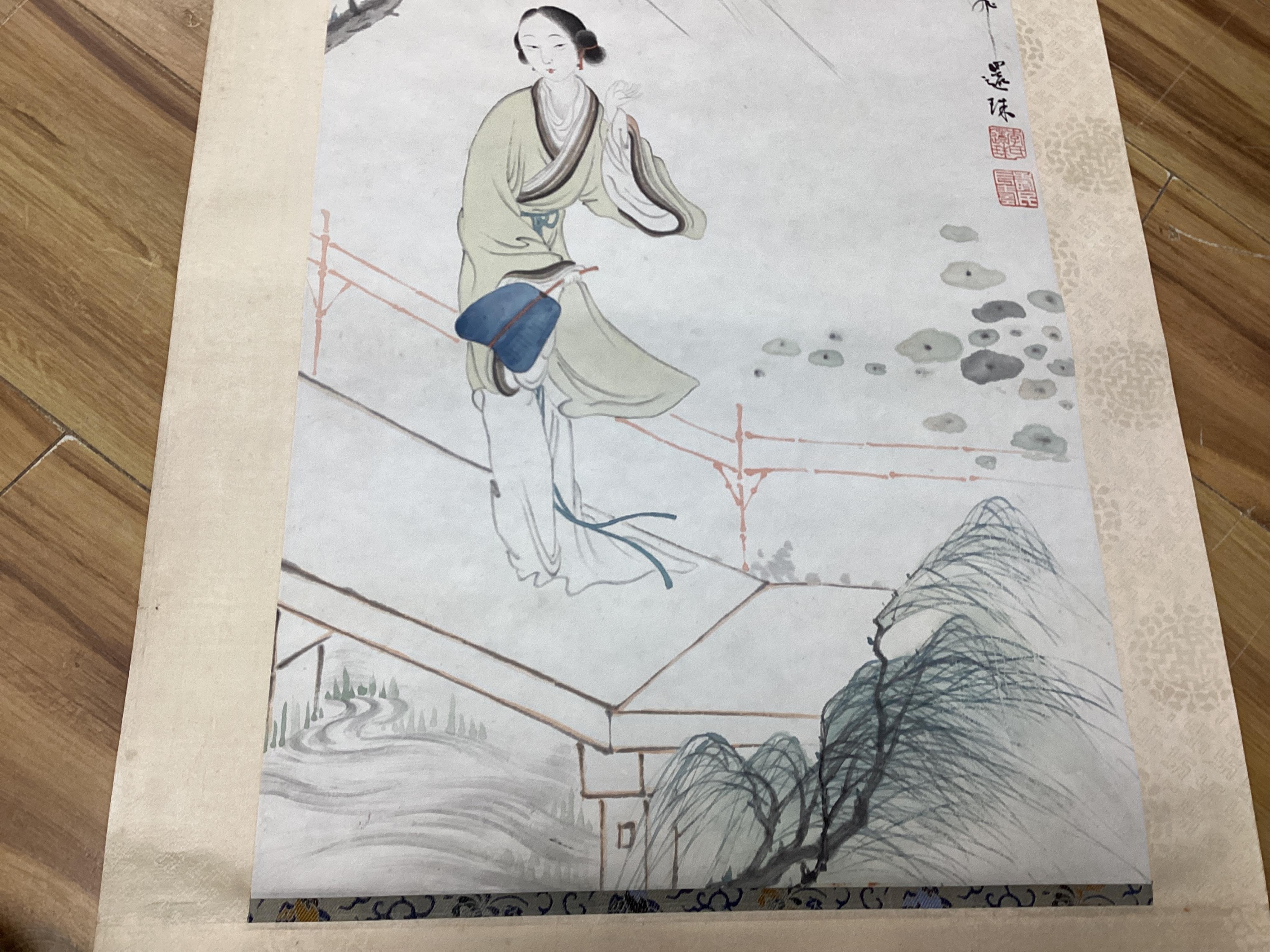 A set of four Chinese scroll paintings of ladies before landscapes, 48cm wide. Condition - fair